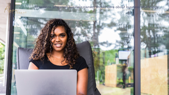 A small business owner sits in a chair, engrossed with her laptop amidst the tranquil view outside the window.